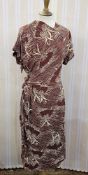 A 1940's brown crepe day dress printed in a cream abstract design with three quarter length sleeves,