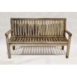 Teak garden bench, 150cm wide, a wicker chair and a small round cast aluminium table, 60cm