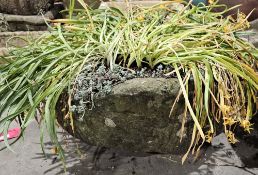 Large composite stone planter with bow front