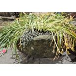 Large composite stone planter with bow front