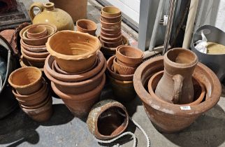 Extensive collection of small and medium terracotta pots to include hanging examples, wall