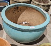 Large sky blue glazed pot of squat rounded form, 52cm diameter approx.