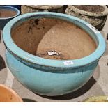 Large sky blue glazed pot of squat rounded form, 52cm diameter approx.