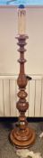 Contemporary Victorian-style wooden turned baluster standard lamp, with faux candlestick top, on