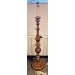 Contemporary Victorian-style wooden turned baluster standard lamp, with faux candlestick top, on