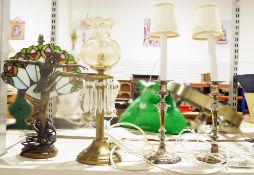 Art Nouveau-style table lamp with a figure of a ballerina and a Tiffany-style shade behind, an oil