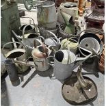 Quantity of galvanised metalwares to include an antique well bucket, various watering cans,