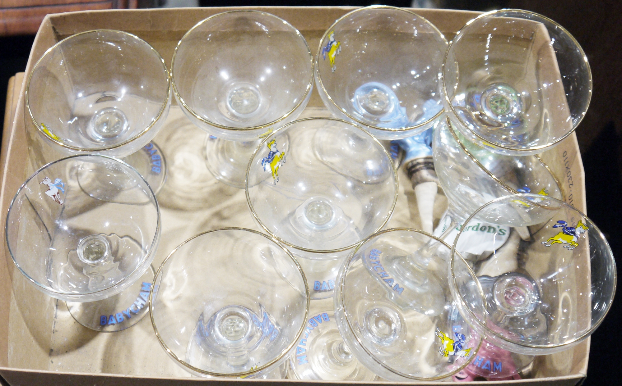 10 Babycham saucers (nine of matching design), four ceramic drink pourers, three in the form of