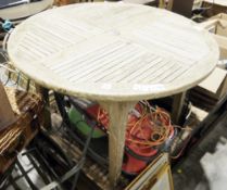 Four folding teak garden chairs and a circular teak garden table (5)