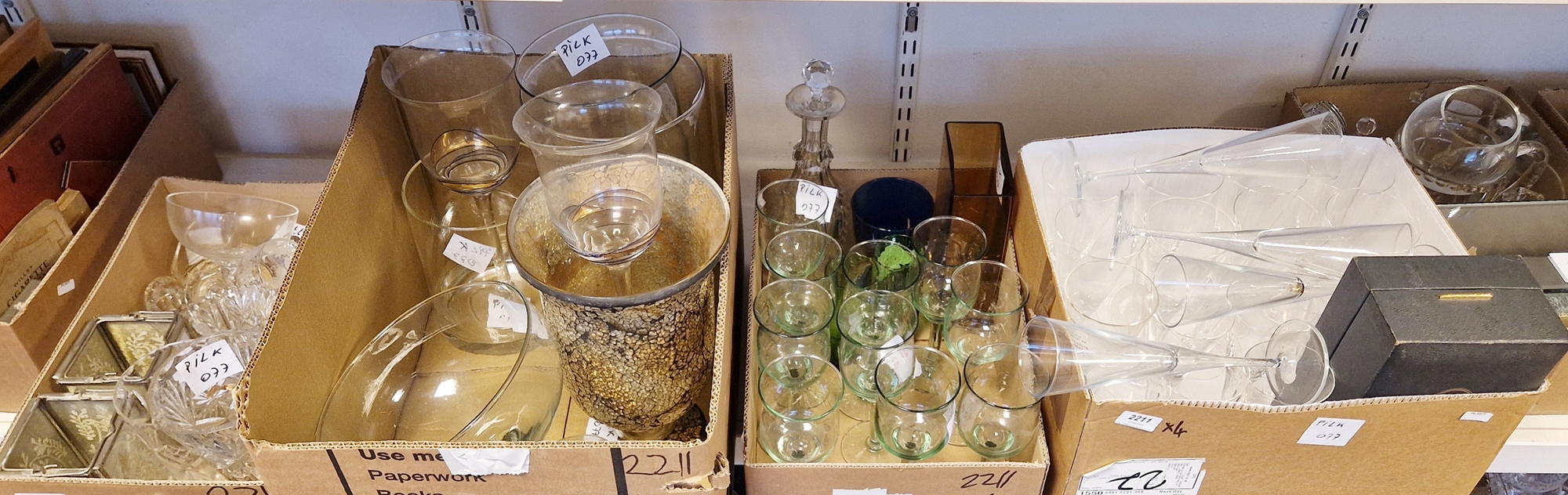Quantity of glassware to include champagne flutes, wine glasses, a glass comport, vases,