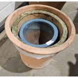 Three terracotta flower pots in sizes, including a blue glazed example, 28cm high max. (3)