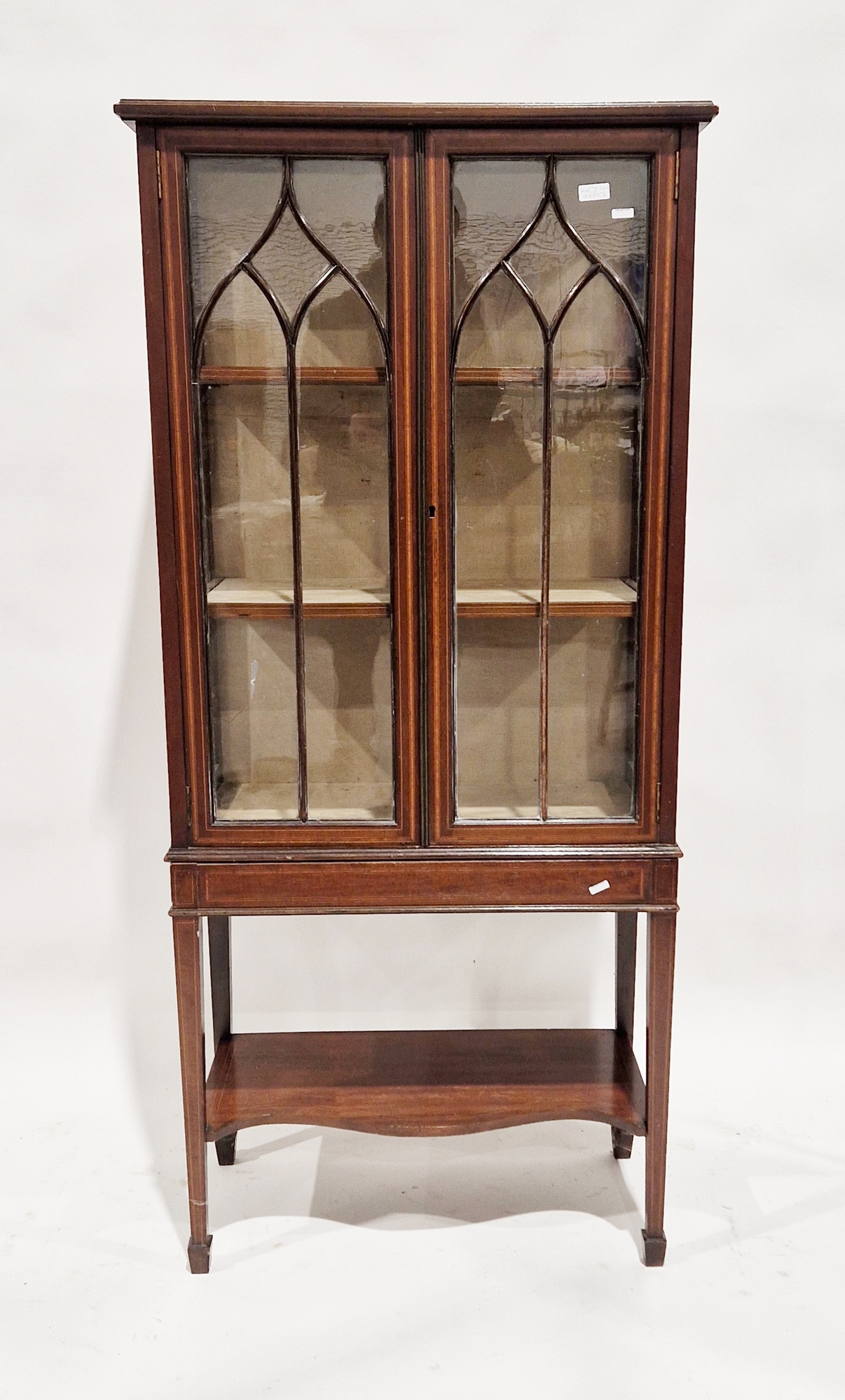 Edwardian mahogany display cabinet with inlaid decoration throughout, the two glazed doors opening