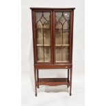 Edwardian mahogany display cabinet with inlaid decoration throughout, the two glazed doors opening