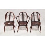 Set of three stained Ercol Windsor-style dining chairs, one being a carver, 82cm high (3)