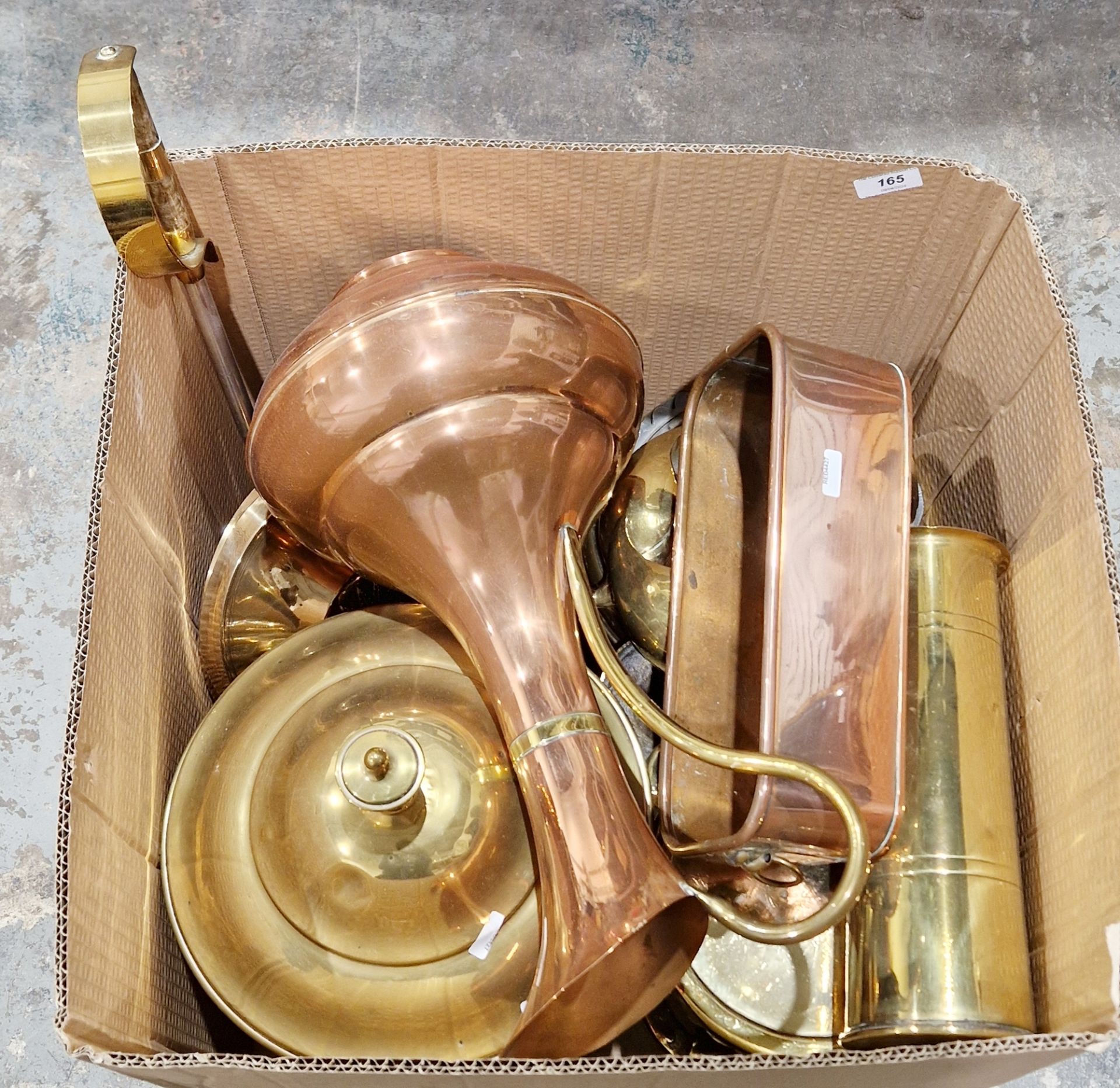 Quantity of copper and brassware to include a brass shell case, a copper planter, pair of brass