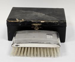 Elizabeth II silver backed engine turned clothes brush, in leather box, engraved with initials and