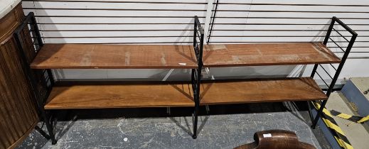 Mid century Ladderax two-section shelving unit comprising three black painted metal frames and
