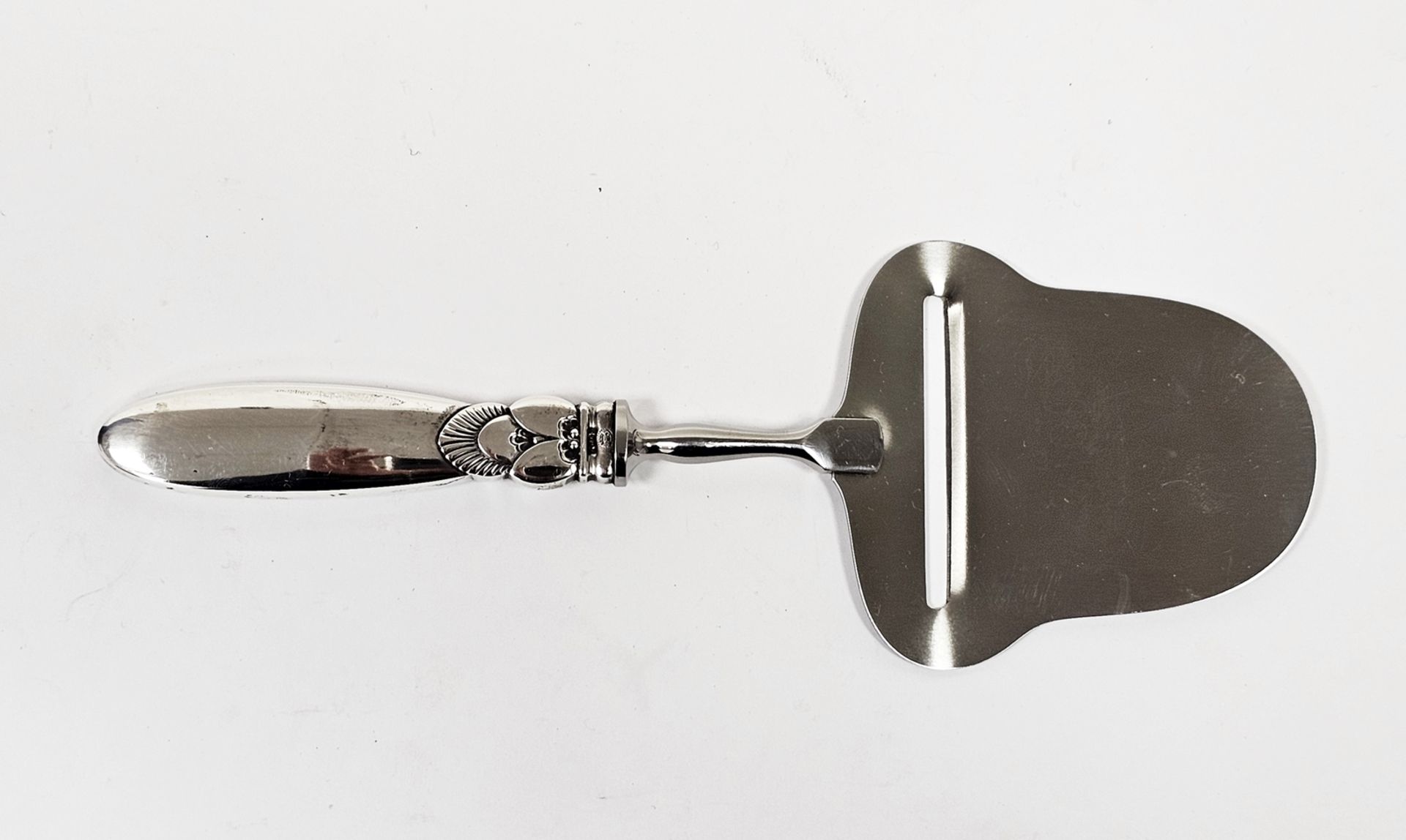 Silver handled cheese parer by Georg Jensen, with import marks for London 1961, the silver handle in