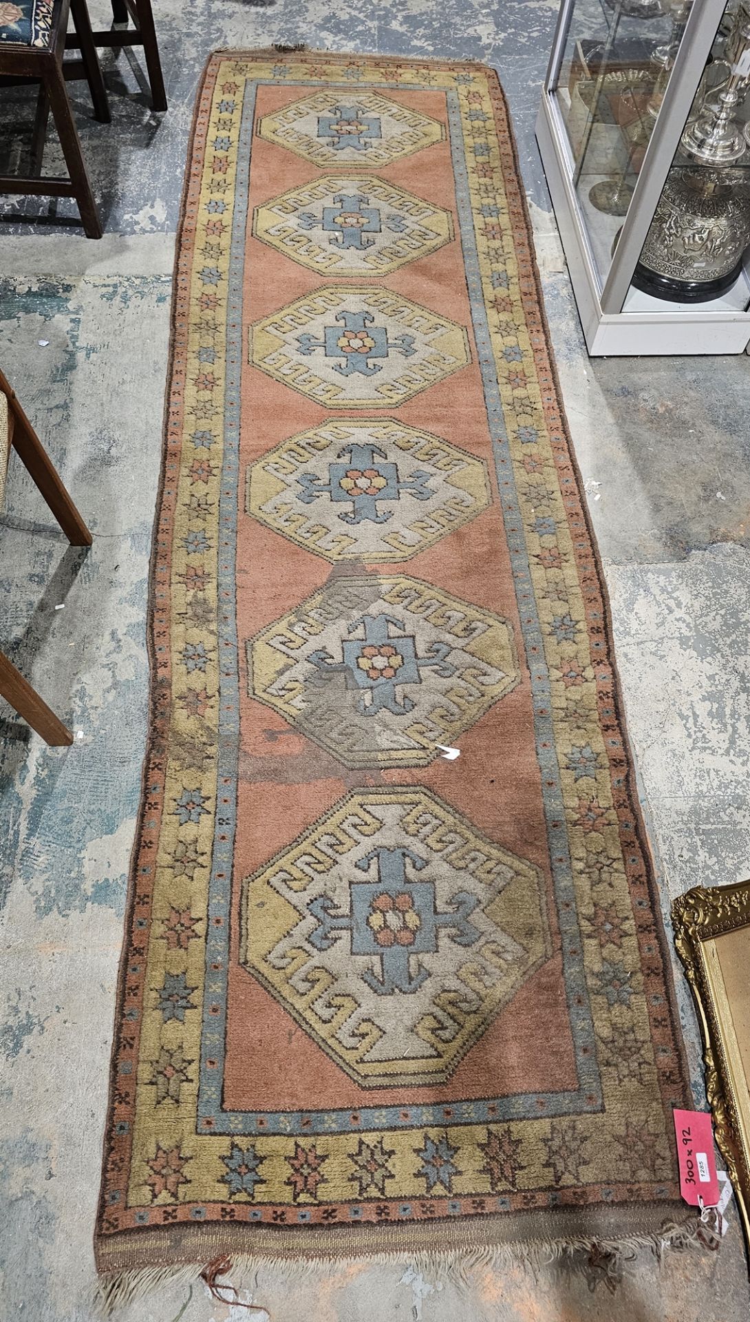 Eastern green ground runner with six central octagonal medallions, multiple floral and geometric