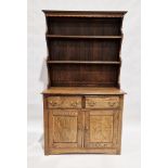 Oak Welsh dresser with two-tier platerack over two short drawers and a two-door cupboard, brass