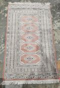 Silk cream ground rug with five central lozenges enclosed by octagonal medallions, multiple