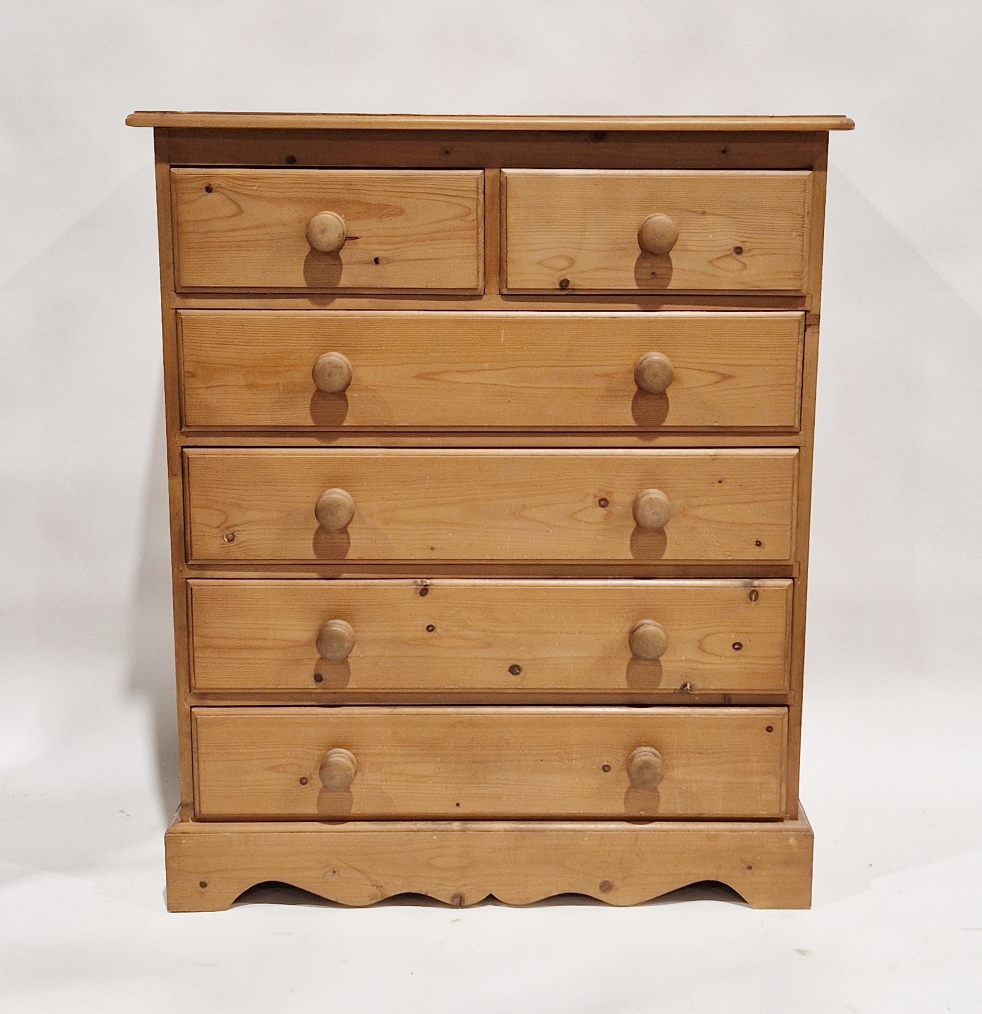 20th century pine chest of two short over four long drawers, each with turned handles, 104cm high