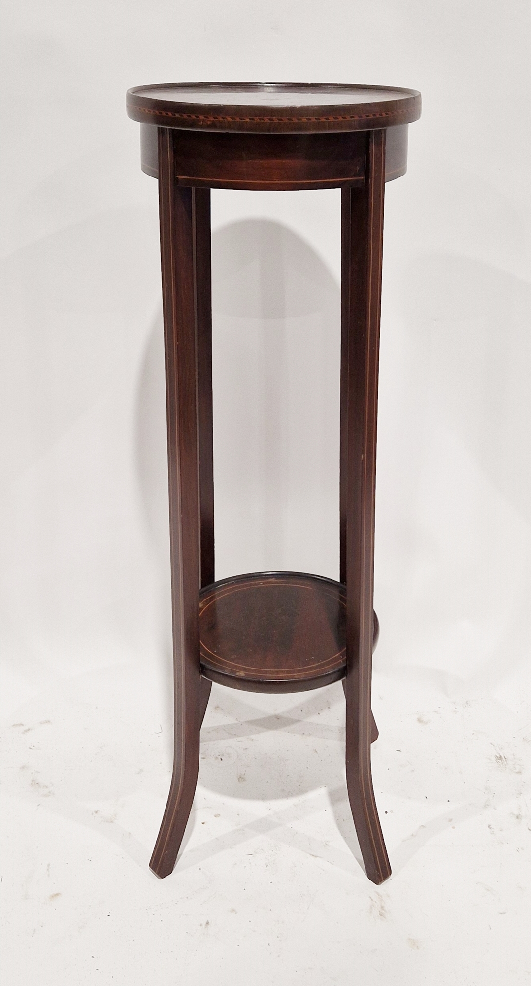 Edwardian mahogany jardiniere stand of circular form with inlaid stringing, 96cm high x 33cm