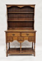 Oak Welsh dresser with three-tier platerack over five drawers of various sizes, over a further