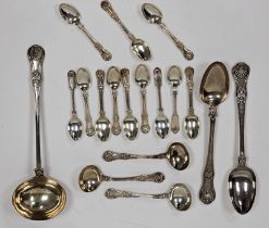 A matched set of George IV and William IV silver spoons, including a large silver serving ladle,