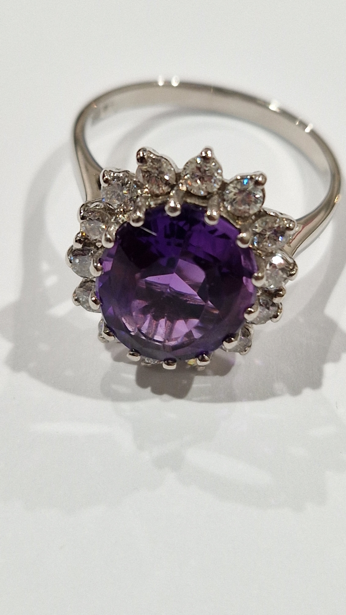 18ct gold, amethyst and diamond cluster ring, the oval amethyst 11.9mm x 9.9mm x 6.4mm deep - Image 2 of 10