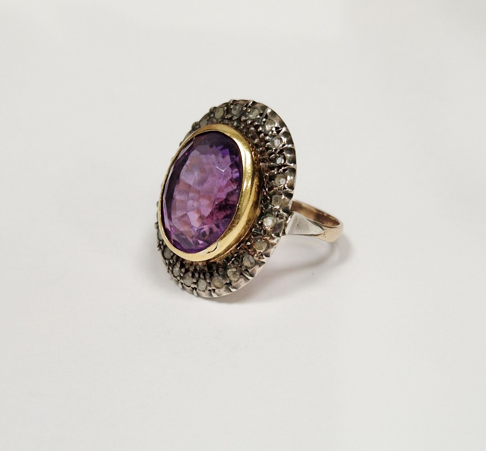 Diamond and amethyst stone dress ring set large oval cut amethyst surrounded by rough/old cut