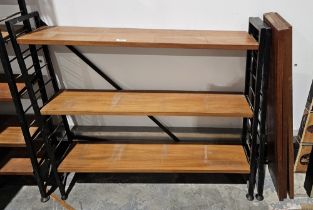 Mid century Ladderax three-section shelving unit comprising three black painted metal frames and six