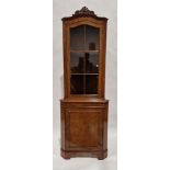 Reproduction yew veneer standing corner cupboard with carved pediment over a single glazed