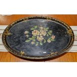 Victorian black lacquered oval tray, decorated with painted and gilt motif (74 x 59cm)
