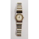 Lady's Omega Constellation wristwatch, gold and stainless steel, the circular dial with raised dot