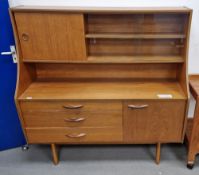 Avalon mid-century teak wood highboard having a raised open back top with a single shelf, sliding