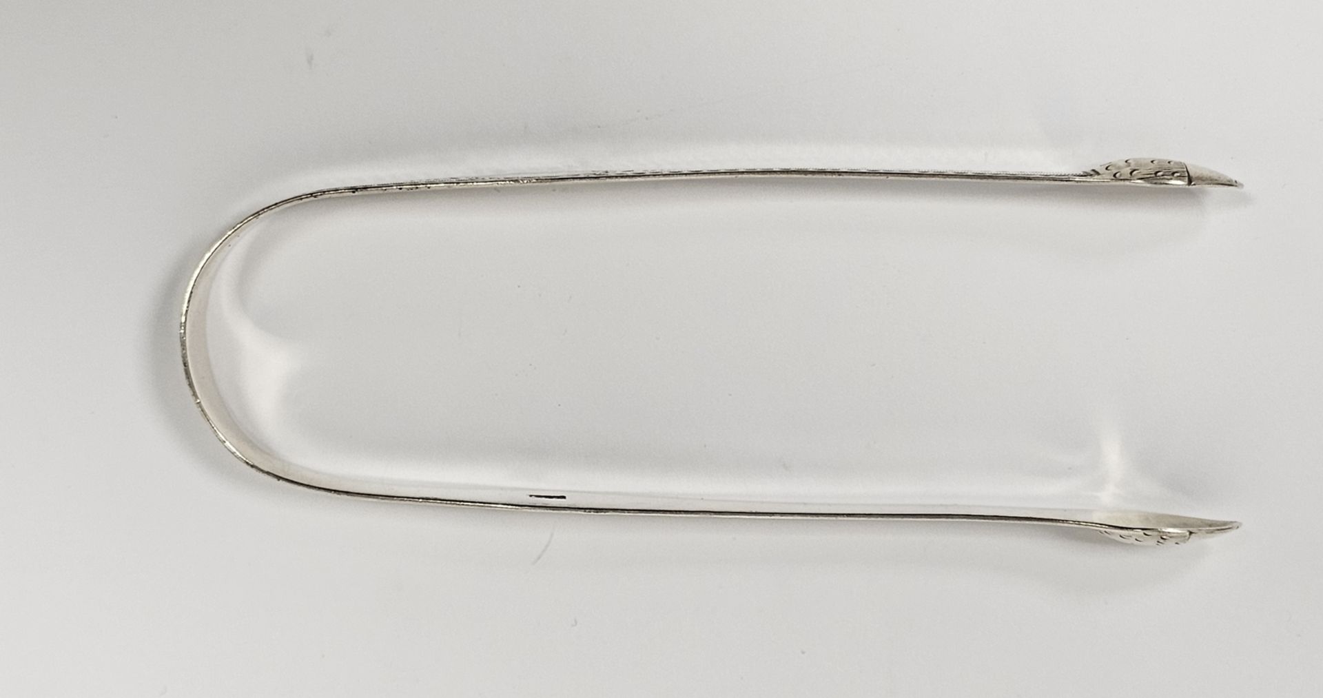 Pair of George III silver bright cut sugar tongs by Thomas Oliphant, 1ozt approx. - Image 2 of 4