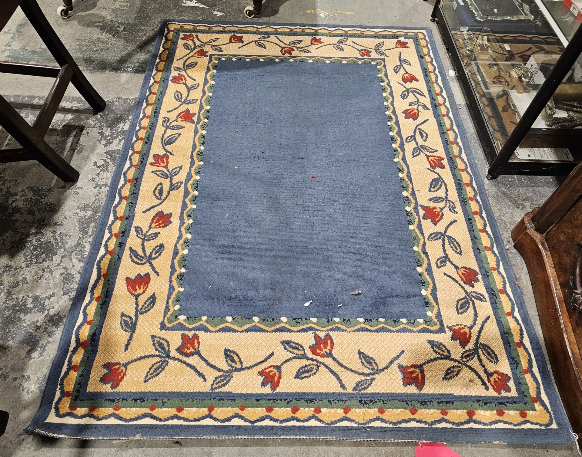 Modern blue ground rug with plain blue field, single floral and geometric borders, 170cm x 120cm
