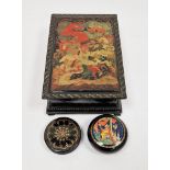 Group of painted Russian lacquer boxes comprising a hinged rectangular example decorated with a