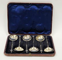 A set of six Victorian silver seal-top soup spoons, the half twisted stem with griffin terminal