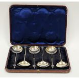 A set of six Victorian silver seal-top soup spoons, the half twisted stem with griffin terminal