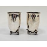 Pair Italian silver-coloured metal goblets, circular and tapering on two dachshund supports,