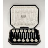 Set of six silver teaspoons with seal tops, cased, hallmarked Sheffield 1926, makers marks for