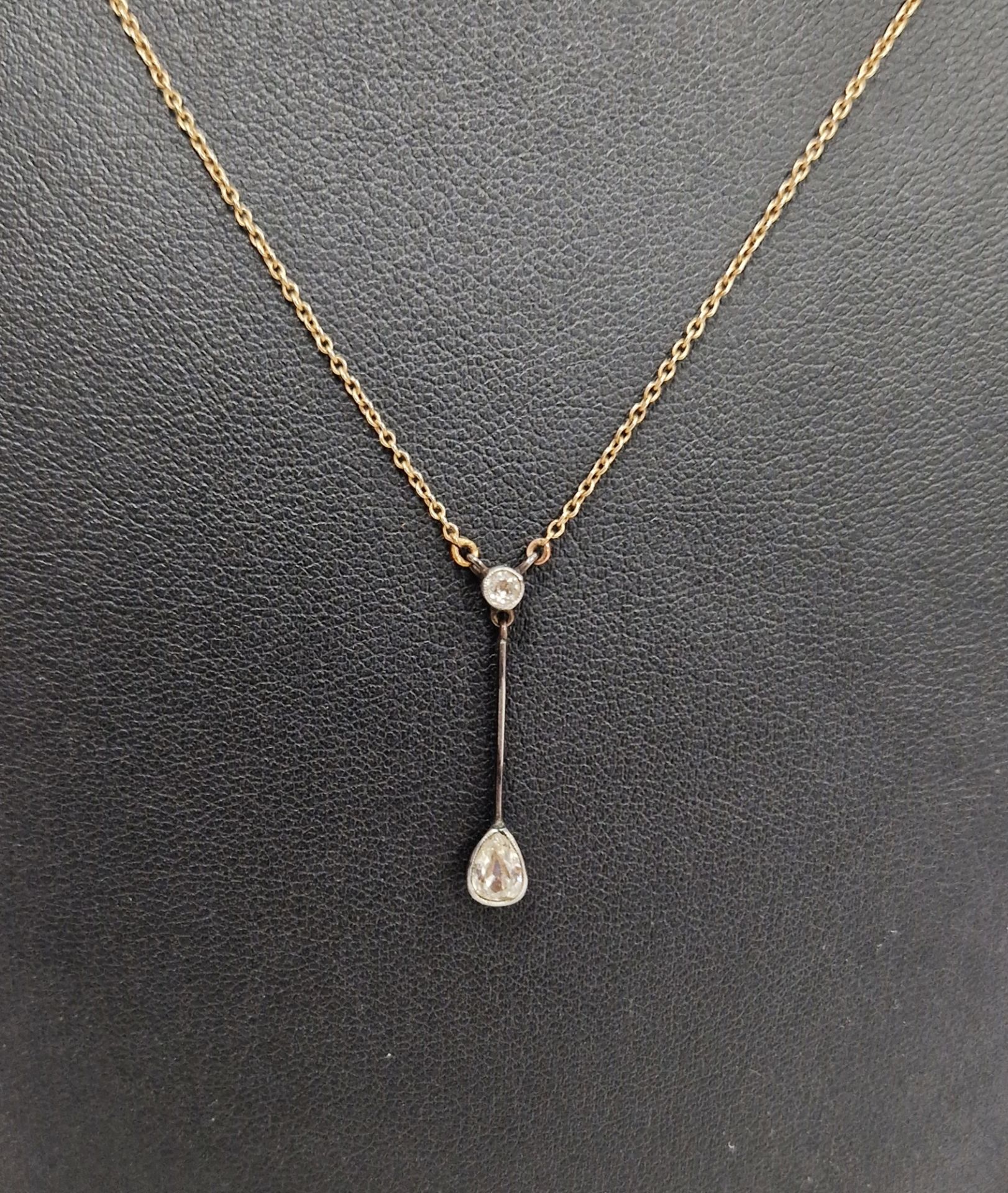 9ct white and yellow gold and diamond pendant necklace having circular diamond collet set above