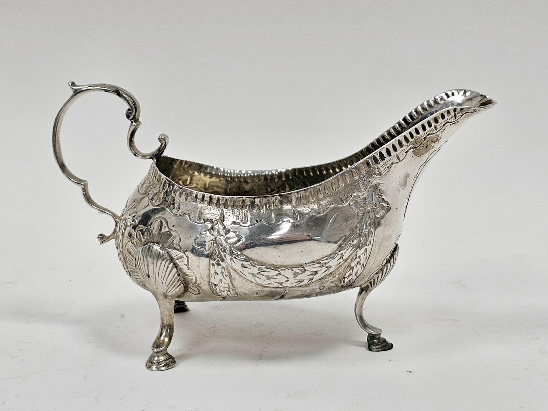 George III Irish silver sauceboat by Matthew West, Dublin (no date letter), decorated with garlands, - Image 2 of 3