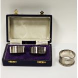Pair of modern silver napkin rings by Da-Mar Silverware, London 1977, in fitted case and one other