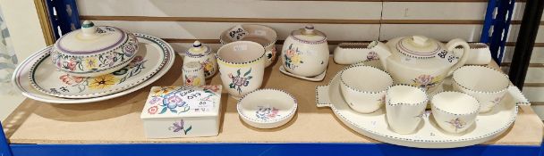 Group of Poole pottery, various printed and painted factory marks, variously painted with flower