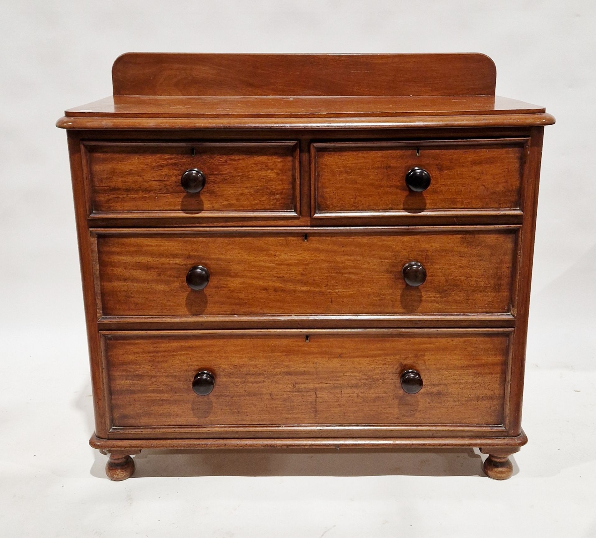 Victorian mahogany chest of drawers with two short over two long drawers, with turned ebonised