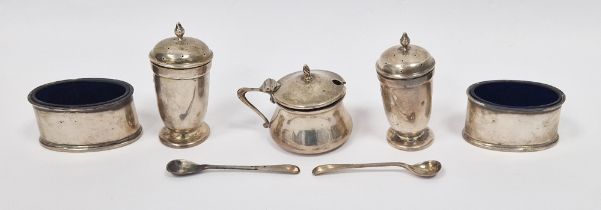 Matched silver condiment set, pair pepperettes, pair oval salts with blue glass liners (mustard