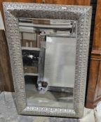 Modern metal pierced Eastern-style framed bevel edged mirror of rectangular form, 126cm x 80cm